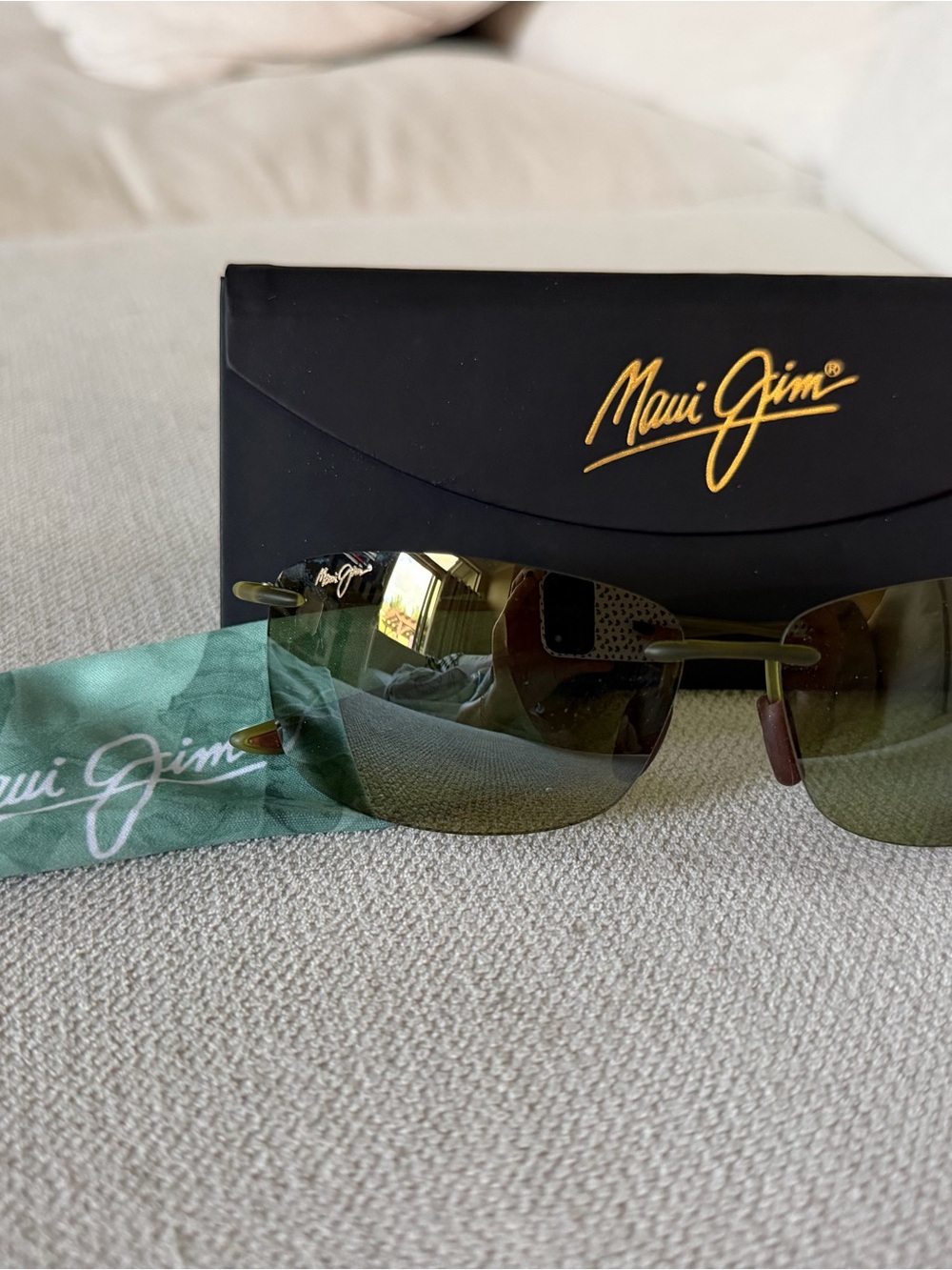 Maui Jim Rimless Sunglasses with Green Lenses and Gold Accents